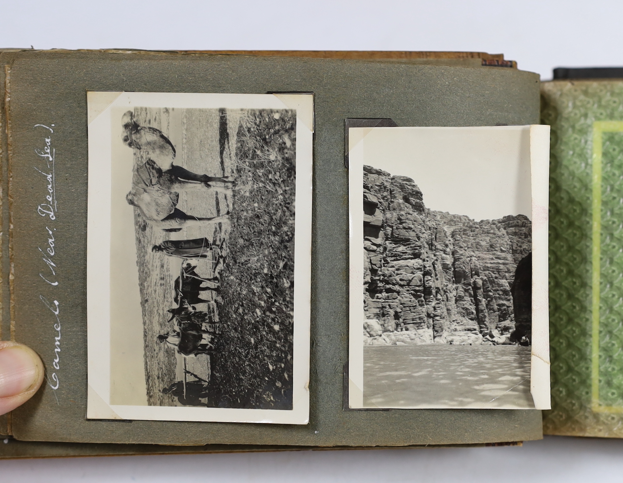 Two photographs albums; an album of early 20th century Middle Eastern travel photographs, together with a 1940s album of mainly naval photographs including war ships and aircraft carriers, some with descriptions on the r